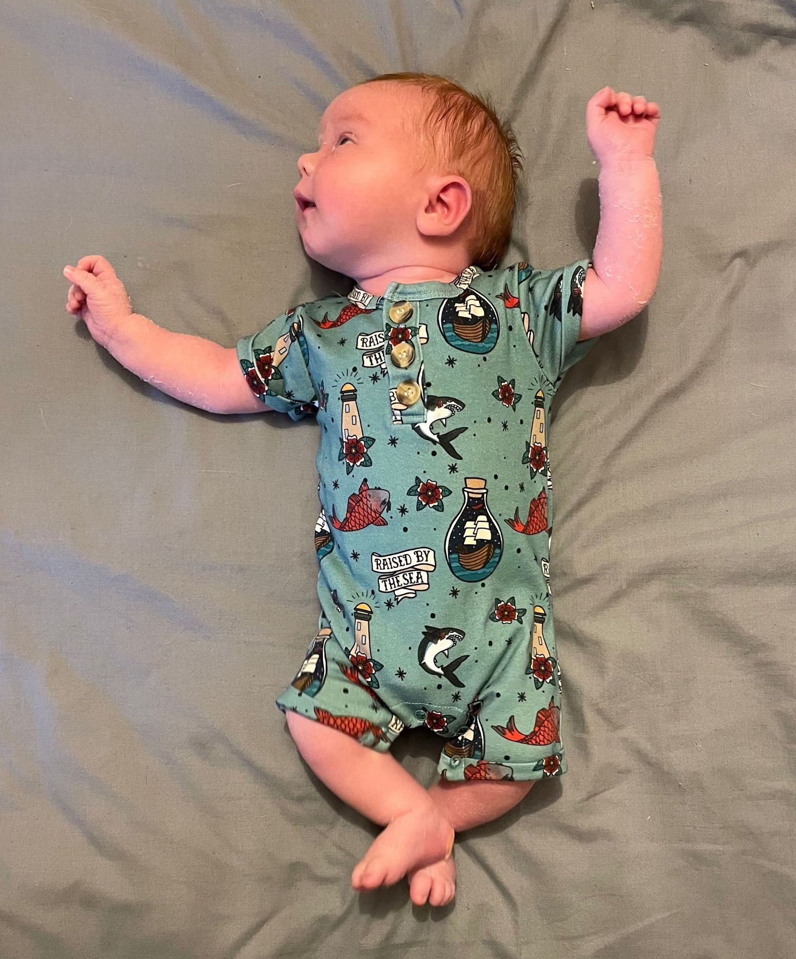 Raised by the sea bottle green romper