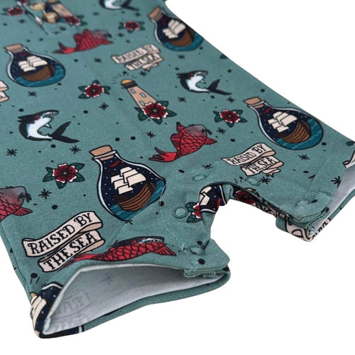 Raised by the sea bottle green romper