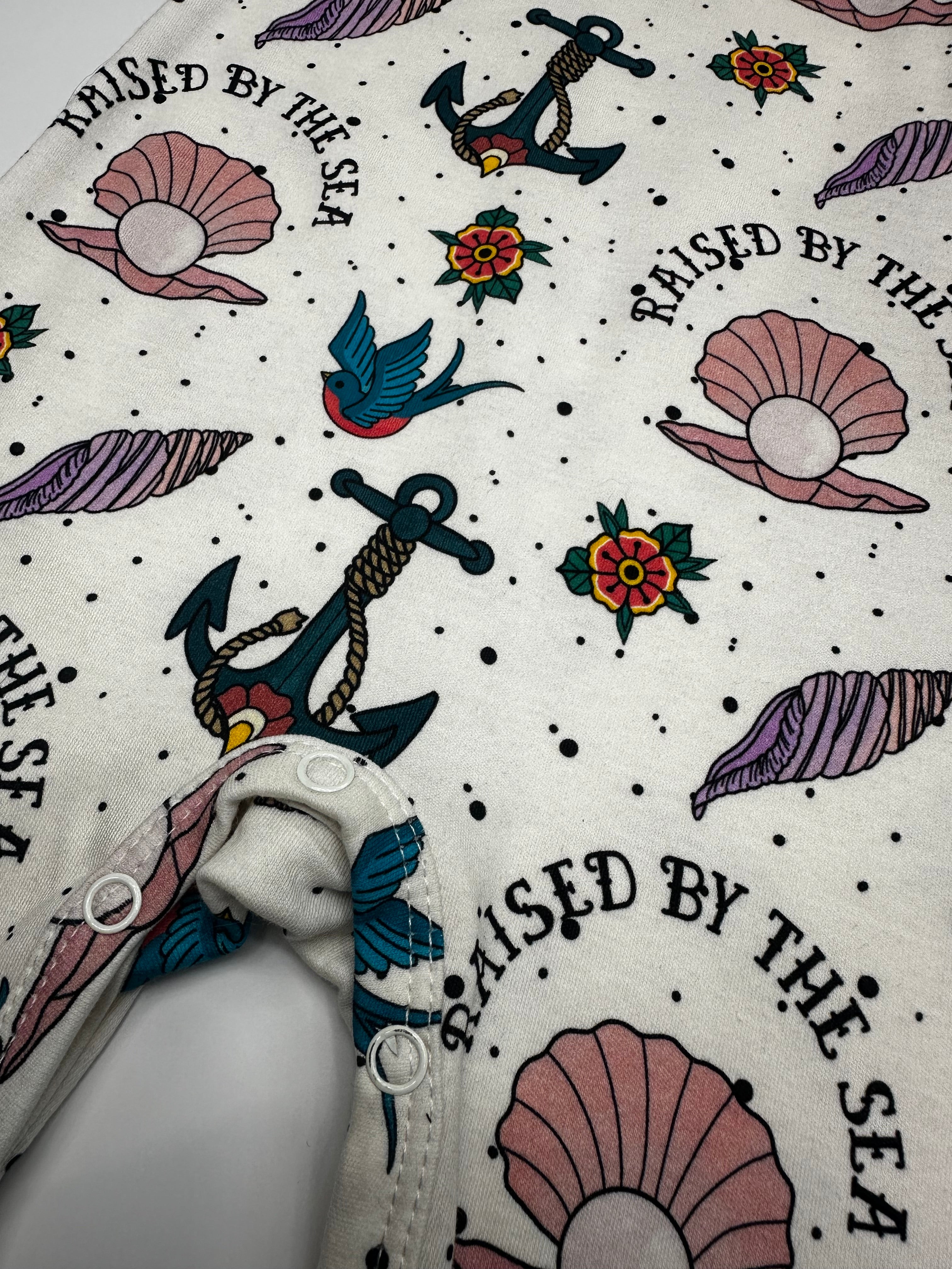 Raised by the sea pearl baby romper